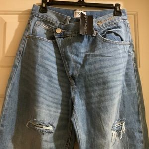 Brand new, never worn crossover button denim jeans